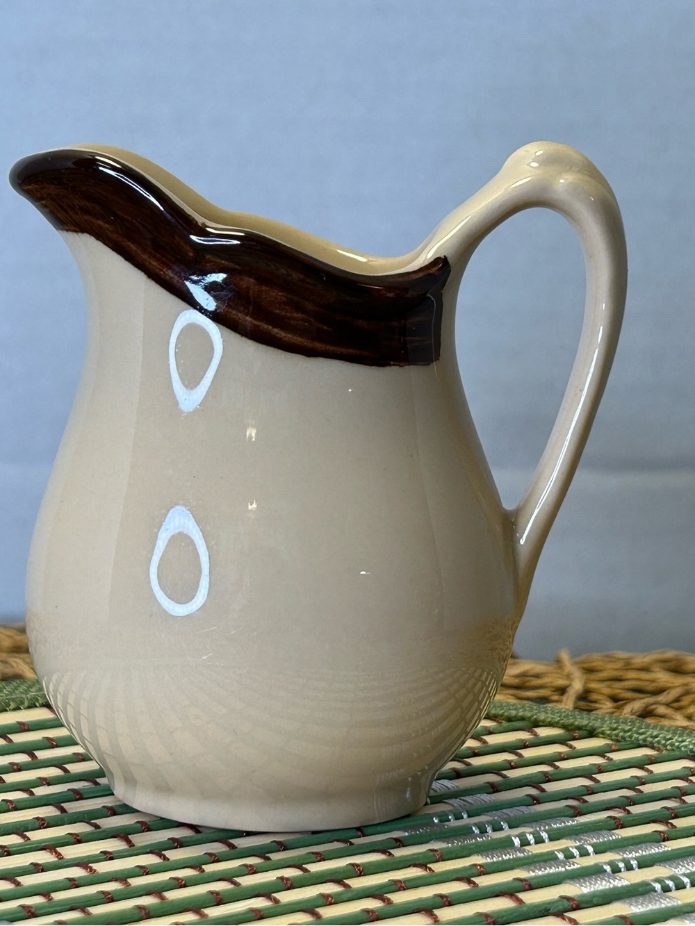 Cream Ceramic Pitcher with Brown Rim - Classic Tabletop Accent